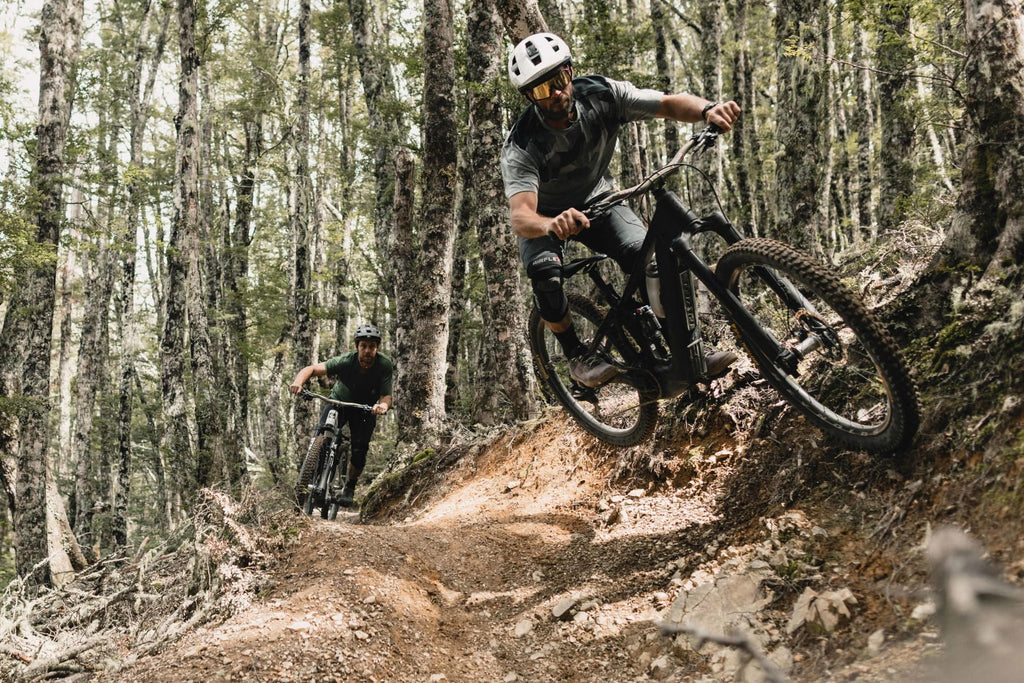 Pivot Shuttle LT charging through technical mountain terrain